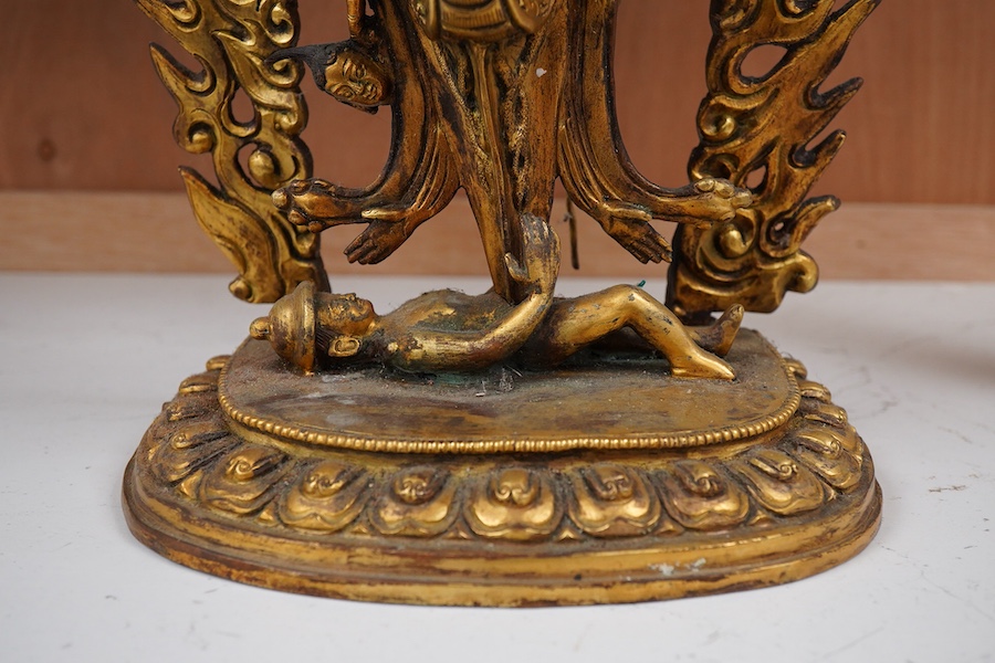 A gilt bronze figure of multi arm Mahakala, 34cm